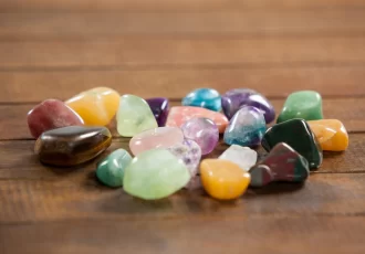Colorful pebbles stones on wooden table